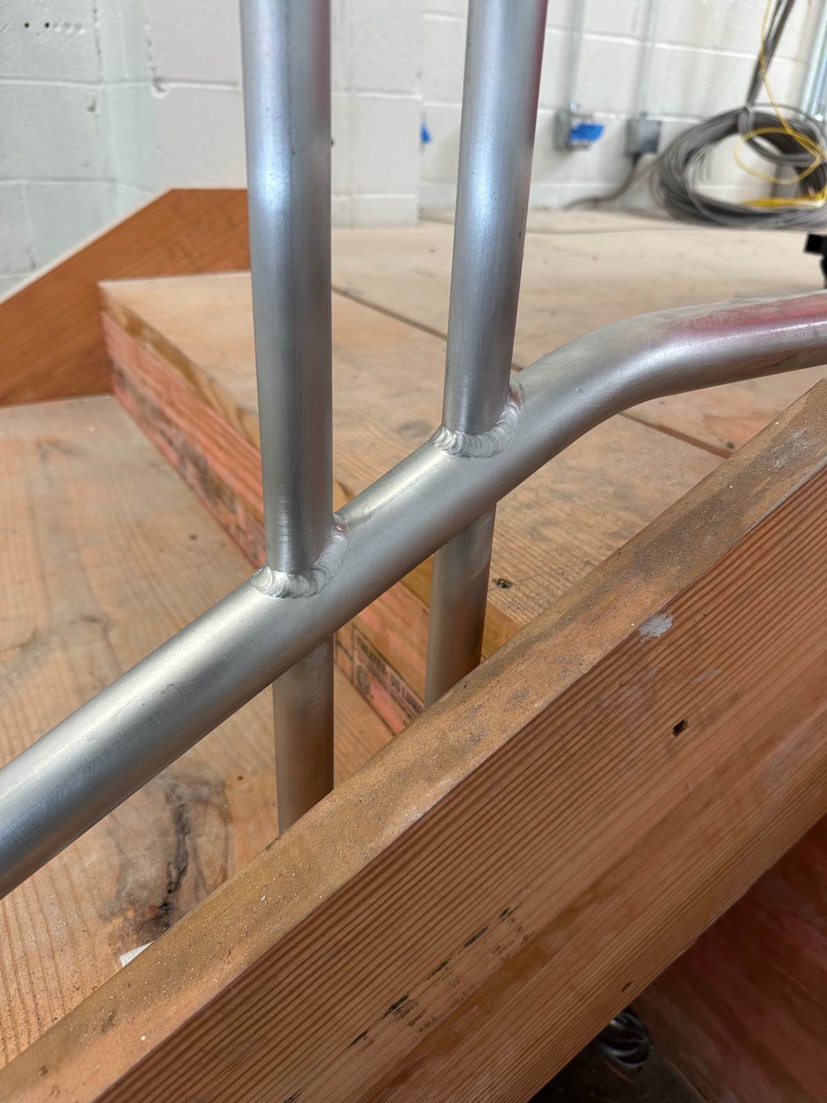 Close detail of picket welds on a bent rail section