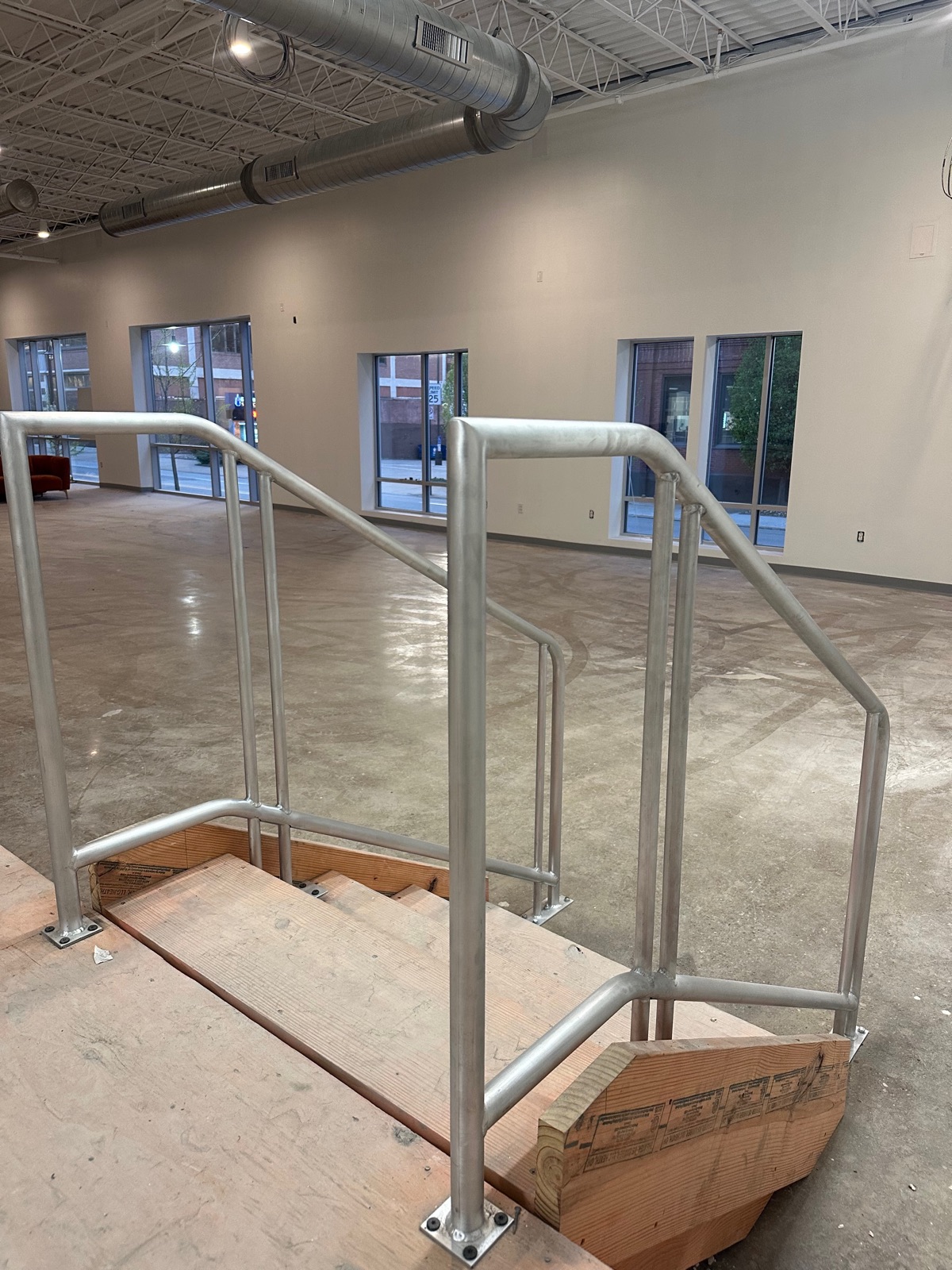 Matched interior stair railings with clean angled transitions