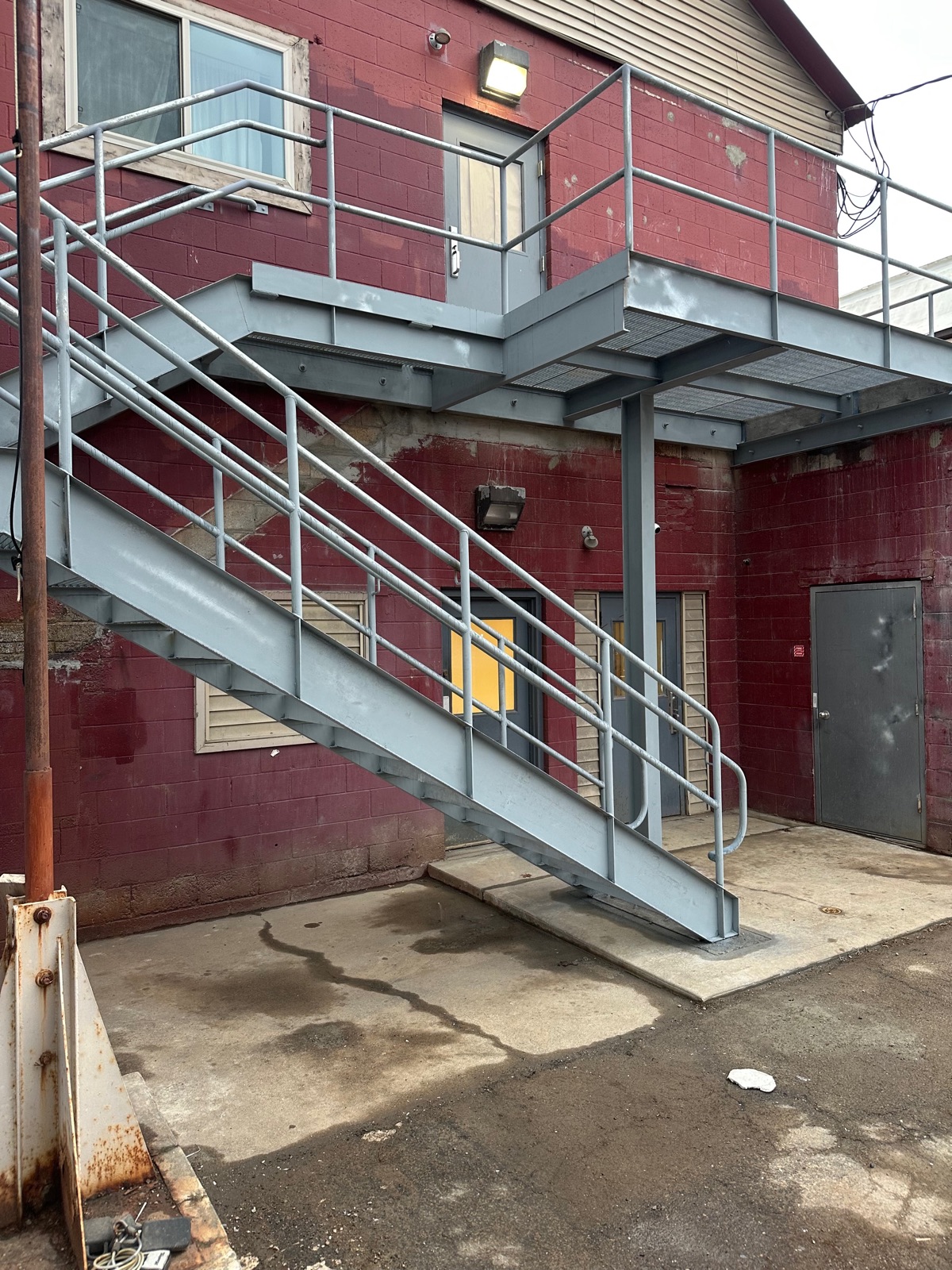 Completed exterior steel stair and landing with welded framing